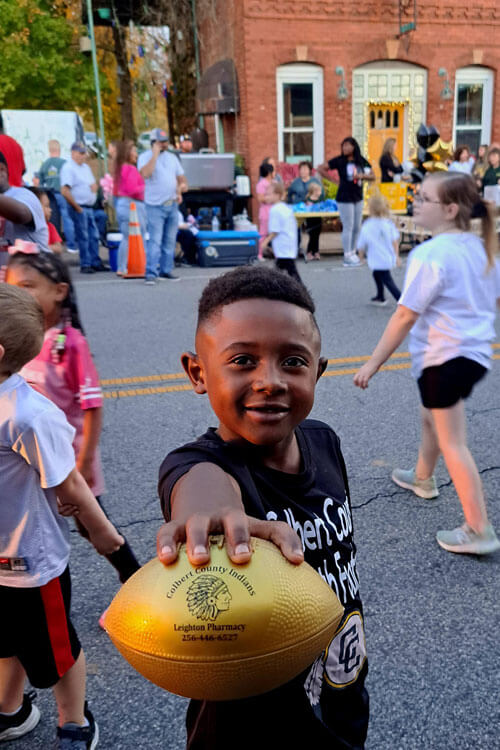 Child holding football